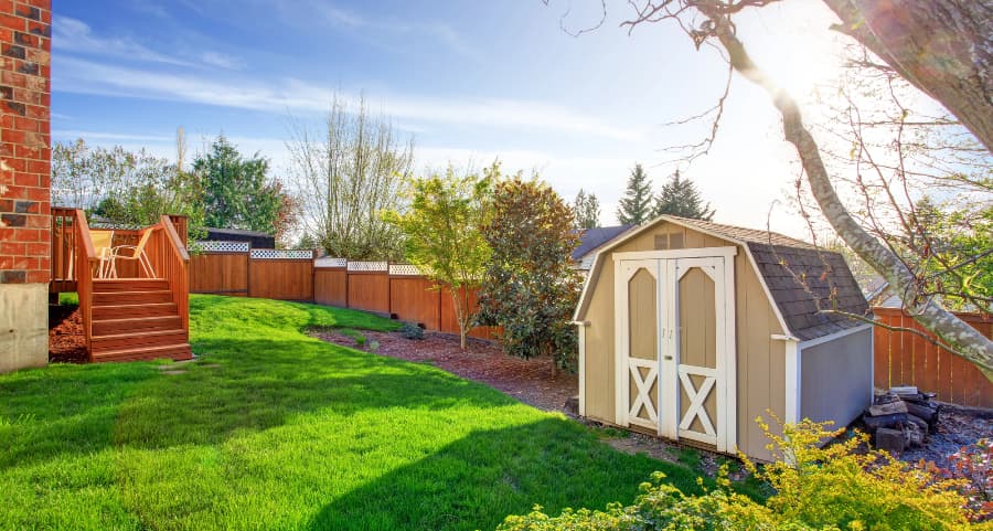 Fenced backyard with storage shed in Fort Wayne